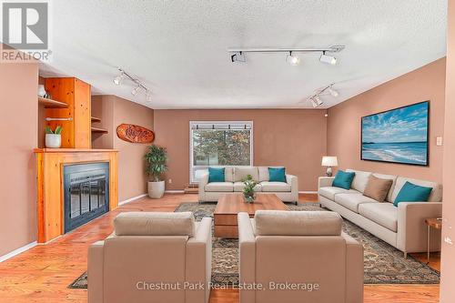 Virtually Staged - 209548 Highway 26, Blue Mountains, ON - Indoor Photo Showing Living Room With Fireplace