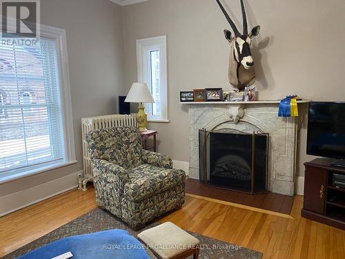 Living room upper unit - 16 William Street, Brockville, ON - Indoor With Fireplace