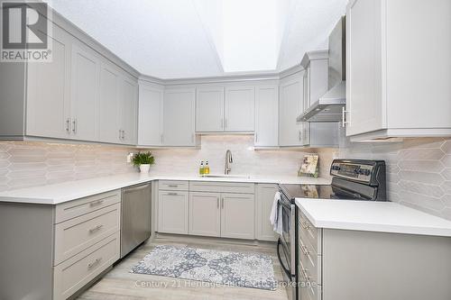 Updated kitchen with plenty of cupboard space - 15 Malkin Avenue, Fort Erie (Lakeshore), ON - Indoor Photo Showing Kitchen