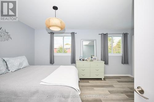 Primary bedroom with 2 windows - 15 Malkin Avenue, Fort Erie (Lakeshore), ON - Indoor Photo Showing Bedroom