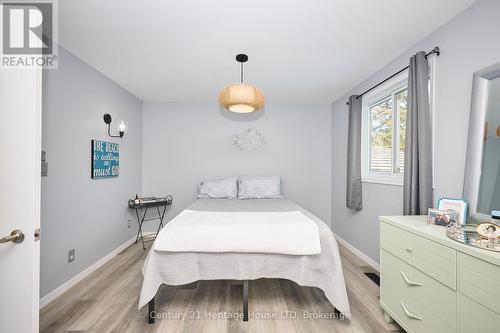 Primary bedroom with 2 windows - 15 Malkin Avenue, Fort Erie (Lakeshore), ON - Indoor Photo Showing Bedroom