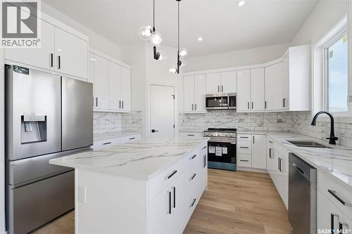 151 Sharma Lane, Saskatoon, SK - Indoor Photo Showing Kitchen With Double Sink With Upgraded Kitchen