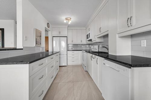 Cuisine - 704-7150 Av. M.-B.-Jodoin, Montréal (Anjou), QC - Indoor Photo Showing Kitchen With Upgraded Kitchen