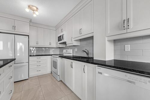 Cuisine - 704-7150 Av. M.-B.-Jodoin, Montréal (Anjou), QC - Indoor Photo Showing Kitchen With Upgraded Kitchen