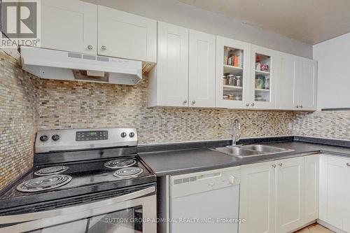 Cook your homemade meals with lots of gusto - 209 - 2245 Eglinton Avenue E, Toronto, ON - Indoor Photo Showing Kitchen With Double Sink