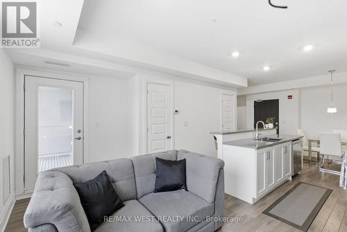 412 - 2 Adam Sellers Street, Markham, ON - Indoor Photo Showing Living Room