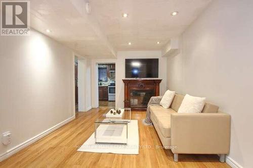 7-13 - 13 Lotherton Pathway, Toronto, ON - Indoor Photo Showing Living Room With Fireplace
