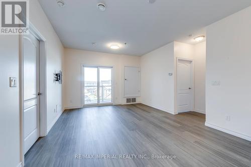 living room - 309 - 1360 Costigan Road, Milton, ON - Indoor Photo Showing Other Room