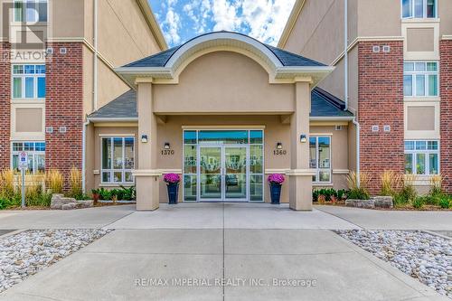 building entrance - 309 - 1360 Costigan Road, Milton, ON - Outdoor With Facade