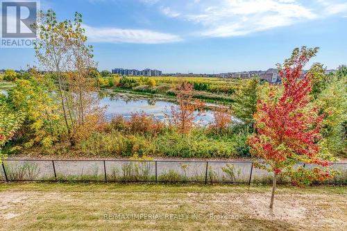 community pond at the back of building - 309 - 1360 Costigan Road, Milton, ON - Outdoor With View