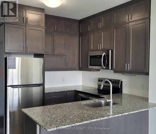 510 - 50 Kaitting Trail, Oakville, ON - Indoor Photo Showing Kitchen With Upgraded Kitchen
