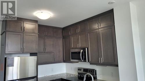 510 - 50 Kaitting Trail, Oakville, ON - Indoor Photo Showing Kitchen