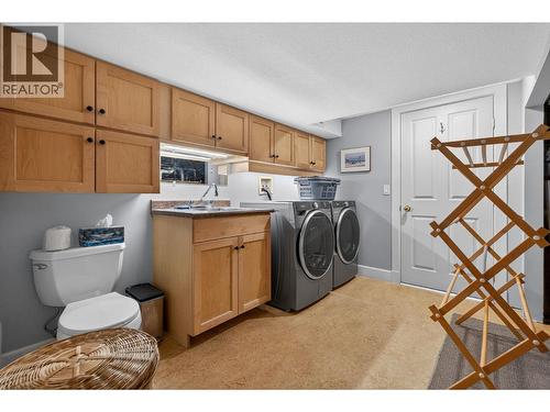 Laundry room in basement with an entrance into the shop - 1774 Highland Drive N, Kelowna, BC - Indoor Photo Showing Laundry Room