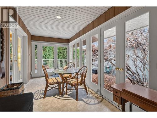 Sunroom looking toward the backyard - 1774 Highland Drive N, Kelowna, BC - 