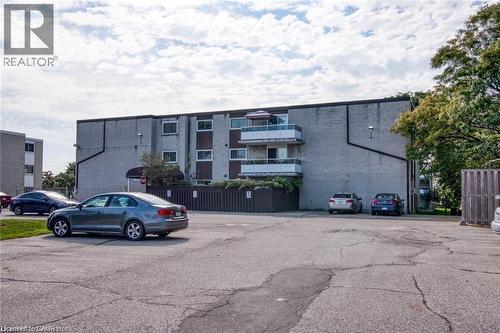 View of apartment building / complex with uncovered parking - 71 Vanier Drive Unit# 211, Kitchener, ON - Outdoor