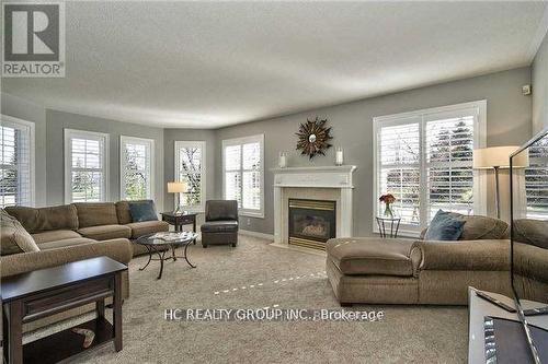 2171 Brays Lane, Oakville, ON - Indoor Photo Showing Living Room With Fireplace