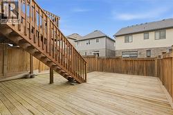Wooden terrace with stairway and a residential view - 