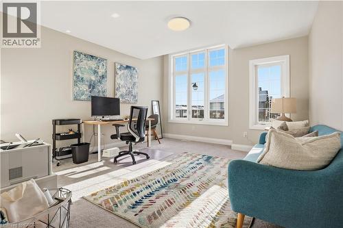 Carpeted home office featuring healthy amount of natural light - 592 Mayapple Street, Waterloo, ON - Indoor