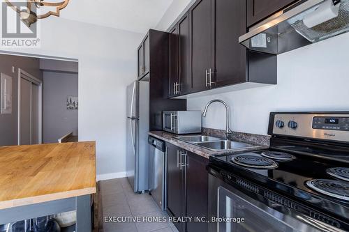 501 - 2486 Old Bronte Road, Oakville, ON - Indoor Photo Showing Kitchen With Stainless Steel Kitchen With Double Sink