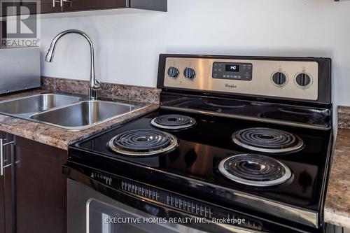 501 - 2486 Old Bronte Road, Oakville, ON - Indoor Photo Showing Kitchen With Double Sink