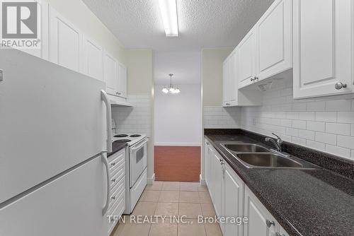 707 - 10330 Yonge Street W, Richmond Hill, ON - Indoor Photo Showing Kitchen With Double Sink