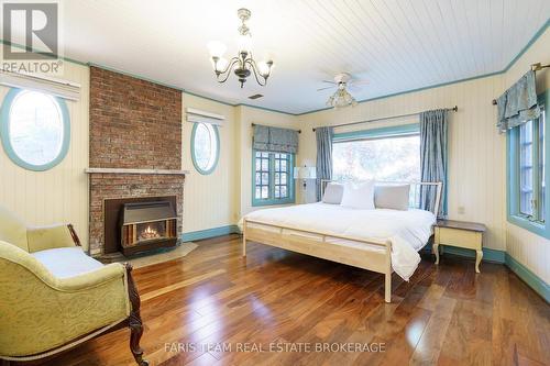 345 Brewery Lane, Orillia, ON - Indoor Photo Showing Bedroom With Fireplace