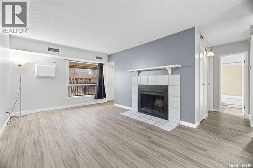 70 Gore Place, Regina, SK - Indoor Photo Showing Living Room With Fireplace