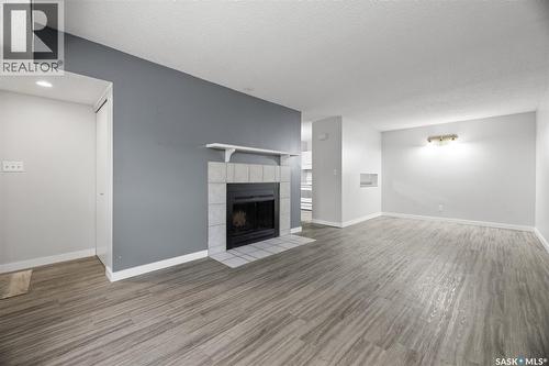 70 Gore Place, Regina, SK - Indoor Photo Showing Living Room With Fireplace