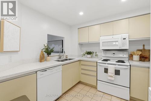 514 - 711 Rossland Road E, Whitby, ON - Indoor Photo Showing Kitchen With Double Sink