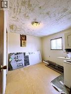Laundry area with wood finished floors - 