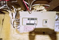 Utility room featuring electric panel - 