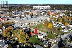 Aerial view of property and surrounding area featuring nearby suburban area - 