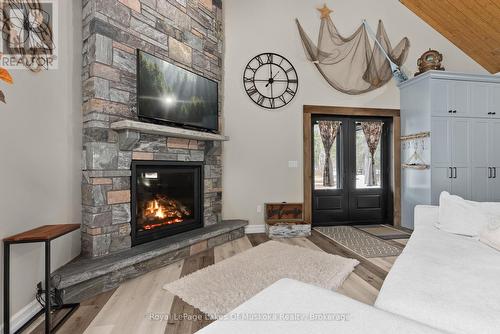 679 Boulder Road, South River, ON - Indoor Photo Showing Living Room With Fireplace