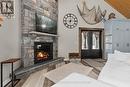 679 Boulder Road, South River, ON  - Indoor Photo Showing Living Room With Fireplace 