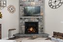 Handmade Granite Fireplace from Manitoulin Island. - 679 Boulder Road, South River, ON  - Indoor Photo Showing Living Room With Fireplace 