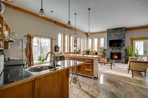 Kitchen - 4257 Rue Du Haut-Bois, Morin-Heights, QC - Indoor Photo Showing Kitchen With Fireplace With Double Sink
