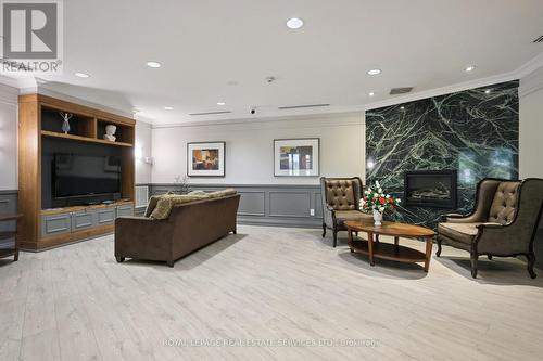 309 - 2391 Central Park Drive, Oakville, ON - Indoor With Fireplace