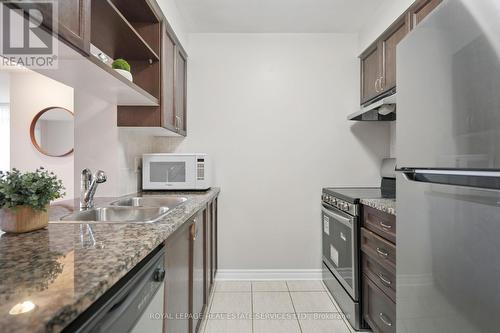 309 - 2391 Central Park Drive, Oakville, ON - Indoor Photo Showing Kitchen With Double Sink