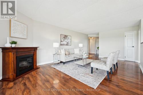 501 - 22 Marilyn Drive, Guelph (Riverside Park), ON - Indoor Photo Showing Living Room With Fireplace