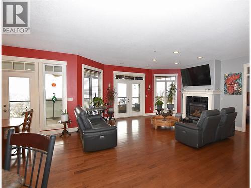 gas fireplace in the living room - 3721 Razorback Court, Vernon, BC - Indoor Photo Showing Living Room With Fireplace