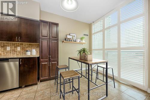 Virtually staged breakfast area - 307 - 208 Enfield Place, Mississauga, ON - Indoor