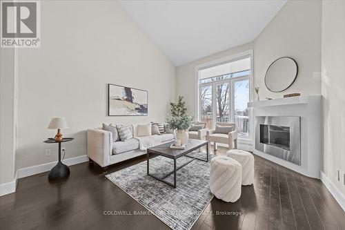 4446 Wildmint Square, Ottawa, ON - Indoor Photo Showing Living Room With Fireplace