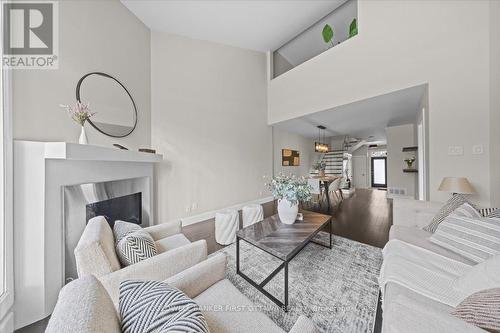 4446 Wildmint Square, Ottawa, ON - Indoor Photo Showing Living Room With Fireplace