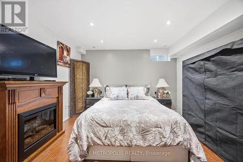 40 - 21 Replin Road, Toronto, ON - Indoor Photo Showing Bedroom With Fireplace
