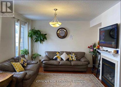 #Main - 30 Sea Lion Road, Brampton, ON - Indoor Photo Showing Living Room With Fireplace