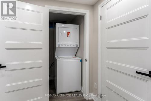 stacked washer/dryer - 47 Mahoney Avenue, Toronto, ON - Indoor Photo Showing Laundry Room