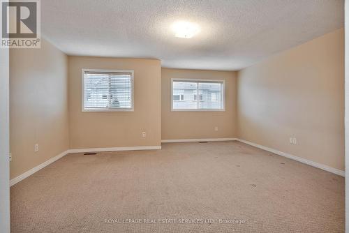 Generous Primary Bedroom Offers a Walk-In Closet - 1765 Cobra Crescent, Burlington, ON - Indoor Photo Showing Other Room