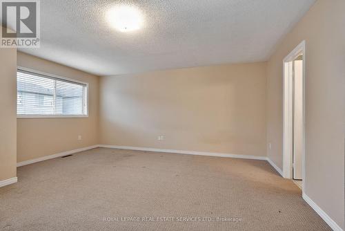 Generous Primary Bedroom Offers a Walk-In Closet - 1765 Cobra Crescent, Burlington, ON - Indoor Photo Showing Other Room