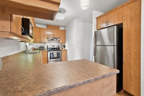 Cuisine - 101-6535 Boul. Chevrier, Brossard, QC - Indoor Photo Showing Kitchen With Double Sink