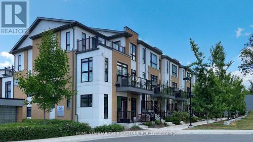 H212 - 90 Canon Jackson Drive, Toronto, ON - Outdoor With Facade